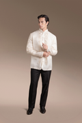 Man wearing a Onesimus Barong Tagalog for Men Textured Natural Faux Silk and black pants on a clean background