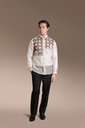 Man wearing a traditional Onesimus Barong Tagalog Attire in Textured Faux Silk and black pants on a beige background