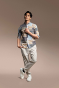 A man modeling a Onésimus Men's Casual Shirts Geometric Prints, set against a solid warm brown studio background.